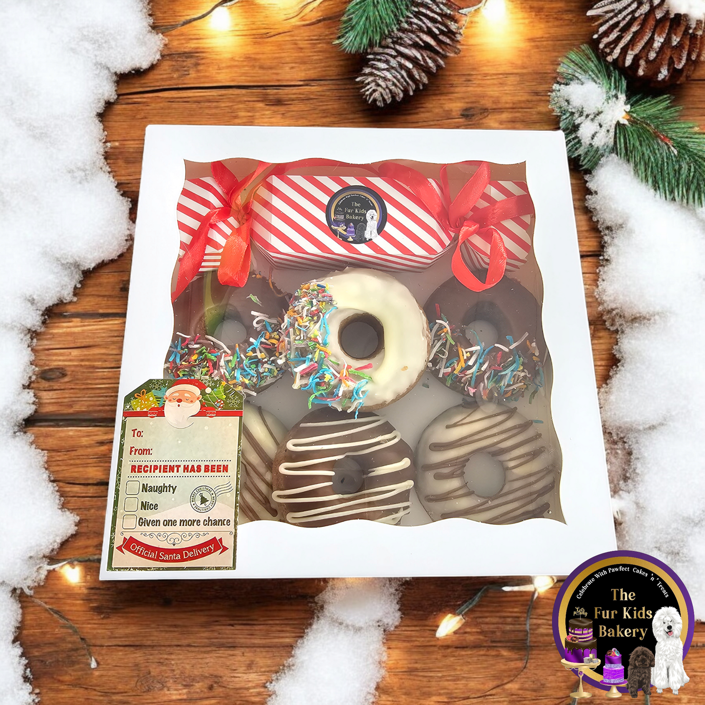 Dog Christmas Box. Dog Christmas present with donuts, bon bon cracker. The Fur Kids Bakery Logo